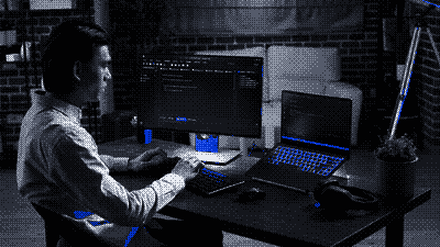 Pixel-art scene of a developer at work